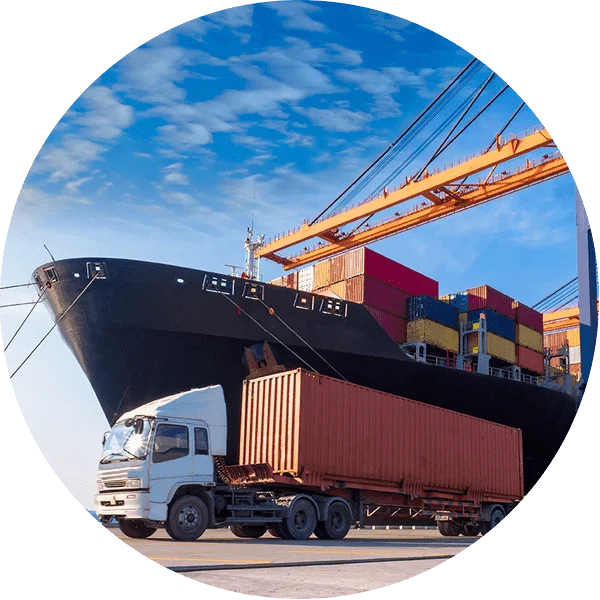 A Cargo ship and a container lorry in a dock yard