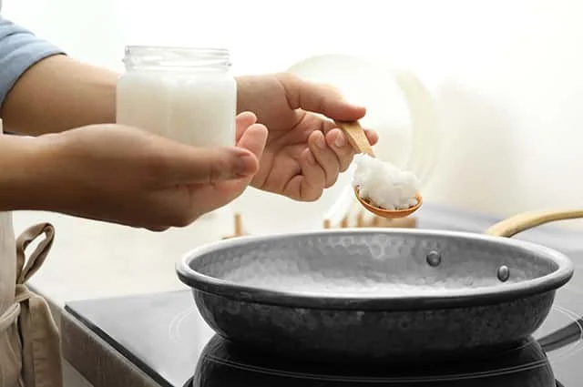 Virgin coconut oil is about to put for a cooking pan